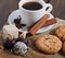 Chocolate sesame sweets and aromatic coffee with spices