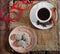 Chocolate sesame sweets and a cup of fragrant coffee with spices