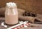 Chocolate shake marshmallows. Glass cup of cocoa with marshmallows on wooden table. Close-up. Copy space