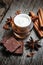 Chocolate skin treatment. Cosmetic jar with lotion, cocoa, anise, cinnamon sticks.