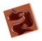 Chocolate square decorated with melted chocolate