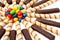 Chocolate sticks with a cream and the multi-coloured sweets isol