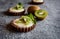 Chocolate tartlets filled with coconut cream and topped with kiwi slices