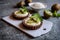 Chocolate tartlets filled with coconut cream and topped with kiwi slices