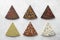 Chocolate triangle pieces on white stone background