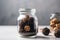 Chocolate truffles in a glass jar on a gray background, Delicious truffle cake closeup inside a glass jar, AI Generated