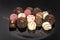 Chocolate truffles and pralines with pink dots
