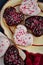 Chocolate and vanilla heart donuts with tiny red heart sprinkles on top