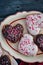 Chocolate and vanilla heart donuts with tiny red heart sprinkles on top