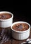 Chocolate vegan dessert - aquafaba mousse - egg free, non-dairy cocoa pudding or souffle decorated with lavender on dark moody bac