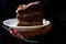 Chocolate Victorian cake slice on a white plate with walnuts dark moody photography