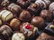 chocolates background with praline assortment chocolate sweets