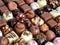 chocolates background with praline assortment chocolate sweets