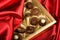 Chocolates box on red satin