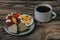 Chocolates with dried fruits and a cup of coffee