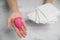 The choice between menstrual cup and sanitary napkin on woman hand