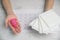 The choice between menstrual cup and sanitary napkin on woman hand