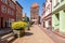 Chojnice, pomorskie / Poland - June, 13, 2020: City walls with an entrance gate. Historic buildings in Central Europe