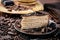 Chokolate cake on dark plate with butter creme