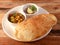 Chole Bhature, spicy Chick Peas curry also known as Chole or Channa Masala is traditional North Indian main course recipe and