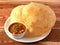 Chole Bhature, spicy Chick Peas curry also known as Chole or Channa Masala is traditional North Indian main course recipe and