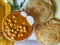 Chole Puri dish in a plate. Chole Poori receipe in a plate. Chickpeas receipe in a plate.