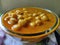 Chole receipe in a bowl. Chana masala receipe on plain background. Chickpeas receipe in a bowl.