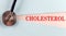 CHOLESTEROL word made on torn paper, medical concept background