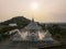 Chonburi, March 12, 2023. Wat Phon Prapa Nimit, This striking white Buddhist temple in a tranquil setting features a silver and