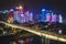Chongqing, China - Dec 22, 2019: Aerial view of Huang Hua Yuan bridge over Jialing river in the night with lights
