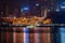 Chongqing, China - Dec 22, 2019: Night neon ight l view of historic Hongya cave by Jialing river with qian si men bridge