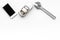 Choose car service. Wrench near car toys and cell phone on white background top view copyspace