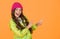 Choose between cutest and trendiest. Girl long hair yellow background. Cold season concept. Winter fashion accessory