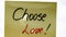 Choose love handwriting text close up isolated on yellow paper with copy space