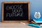 Choose your future written on a blackboard