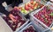 Choosing seasonal fresh fruits - plums and apples