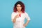 Choosing you! Portrait of hipster woman with fancy red hair in white shirt pointing finger to camera