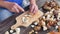 Chop fresh wild mushrooms. Close up shot of hands with a knife cutting mushrooms. Man hand carefully cut wild mushrooms on desk