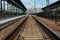 CHOP, UKRAINE, MAY 12, 2016. Chop City Train Station in , Ukraine with railways going in to horizon and arriving train.