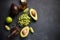 Chopped avocado in glass bowl and avocado Halves