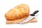 Chopped bread with knife on wooden utensil