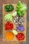 Chopped fresh vegetables with lime and beef on rustic wooden board. Tacos ingredients. Top view. From above. Flat lay, overhead