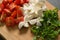 Chopped ingredients for salad, mozzarella, spinach and cherry tomatoes