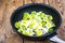 Chopped leeks in frying pan