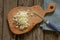 Chopped onion lies on a wooden board on a table in the kitchen