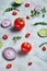 Chopped onion, red hot pepper and spice isolated on white background, top view, close-up, selective focus