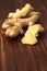 Chopped and peeled young ginger root on a wooden table