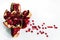 Chopped pomegranate with scattered pomegranate seeds on a light background instagram photo