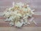 Chopped potatoes heap on wooden background