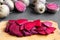 Chopped red beetroot on wooden chopping board, side view. Closeup.